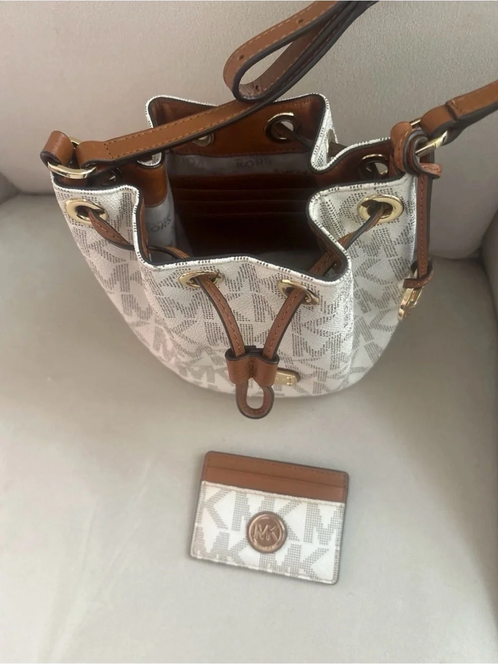 Michael Kors Cream Logo Drawstring Crossbody with Brown Trim and Gold Hardware